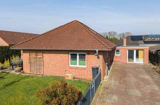 Haus kaufen in 26810 Westoverledingen, Gepflegter Bungalow mit Kamin, überdachter Süd-West-Terrasse und schönem Grundstück