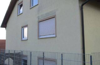 Haus kaufen in 97714 Oerlenbach, Oerlenbach - Teilvermietetes Dreifamilienhaus in Oerlenbach, OT mit 2 Doppelgaragen und 2 Kfz-Stellplätzen