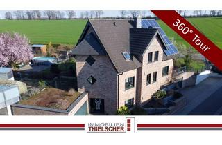 Einfamilienhaus kaufen in 52511 Geilenkirchen, Großes freistehendes Einfamilienhaus mit 2 Garagen, Wintergarten und idyllischem Garten am Feldrand