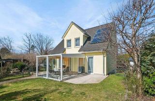 Haus kaufen in 14624 Dallgow-Döberitz, Dallgow-Döberitz - Energieeffizientes Familienhaus mit Wintergarten und großem Garten