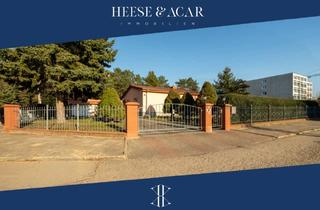 Einfamilienhaus kaufen in 16348 Wandlitz, Wandlitz - Unterkellerter Bungalow mit Doppelgarage auf großem, gepflegtem Grundstück in Basdorf am Waldrand