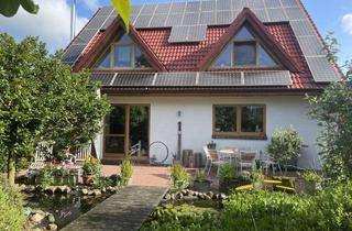 Einfamilienhaus kaufen in 27624 Ringstedt, Exquisites Einfamilienhaus in neuwertigem Zustand mit PV-Anlage,Carport und idyllischer Gartenanlage