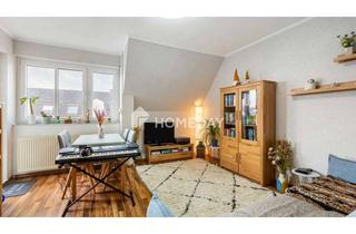 Wohnung kaufen in 63110 Rodgau, Charmante 2-Zimmer-Dachgeschosswohnung mit Balkon, EBK und Tiefgaragenstellplatz