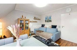 Wohnung kaufen in 63110 Rodgau, Charmante 2-Zimmer-Dachgeschosswohnung mit Balkon, EBK und Tiefgaragenstellplatz