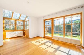 Wohnung kaufen in 82194 Gröbenzell, AIGNER - Sonnendurchflutete 2,5-Zimmer-Wohnung mit Garten in attraktiver Süd-West-Ausrichtung