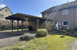 Wohnung kaufen in 24620 Bönebüttel, Wohnen wie im eigenen Haus - Erdgeschosswohnung auf zwei Ebenen mit Garten