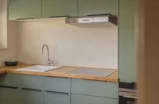 Wohnung kaufen in 25826 Sankt Peter-Ording, Stilvolle Reetdach-Maisonette mit offenem Wohnbereich, Gaubenlicht und Südterrasse