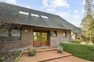 Haus kaufen in 26629 Großefehn, Geschmackvolles Zweifamilienhaus mit Garagen und großem Grundstück in Großefehn