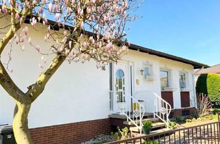 Haus kaufen in 65719 Hofheim am Taunus, Charmanter Winkelbungalow mit Stil, Gartenidylle und viel Lebensqualität in Hofheim-Wallau