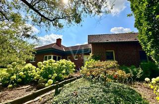 Haus kaufen in 49838 Handrup, Ebenerdiges Wohnen mit Komfort: Bungalow mit Sauna, Kamin und Garten
