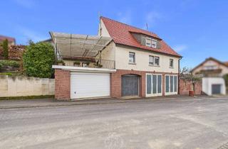Einfamilienhaus kaufen in 97264 Helmstadt, Helmstadt - Großzügiges Wohnhaus mit Garten, Balkon und Werkstattflächen