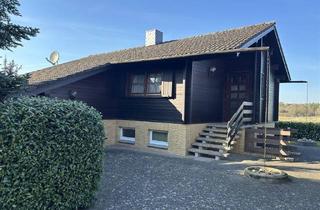 Haus kaufen in 31595 Steyerberg, Steyerberg - Charmantes Blockbohlenhaus mit Sonnenterrasse mit tollem Weitblick u. einer beheizbaren Vollkeller.