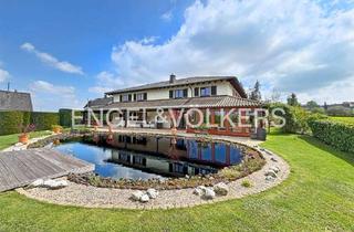 Villa kaufen in Raiffeisenstraße, 56593 Güllesheim, Mediterrane Landhausvilla auf Parkgrundstück mit Teichanlage