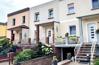 Haus kaufen in 06385 Aken, Charmantes Reihenmittelhaus mit 4 Zimmern und Garage in Aken (Elbe) mit Blick ins Grüne