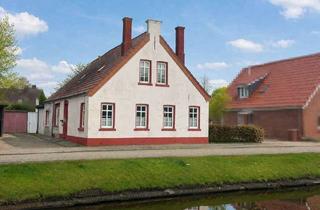 Haus kaufen in 26871 Papenburg, *Charmanter Putzbau in ruhiger Kanallage von Papenburg-Obenende*