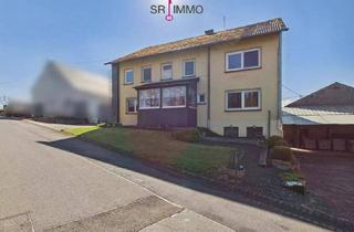 Einfamilienhaus kaufen in 54673 Krautscheid, Krautscheid - Gepflegtes Wohnhaus mit großen Garagen in ruhiger Lage in Krautscheid
