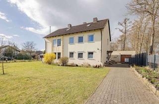 Haus kaufen in 24610 Trappenkamp, Zweifamilienhaus mit Baugrundstück und wohnlich ausgebautem Dachboden in Trappenkamp