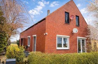 Wohnung kaufen in 28844 Weyhe, Eigentumswohnung mit Garten & Doppelhaus Charakter in ruhiger Lage