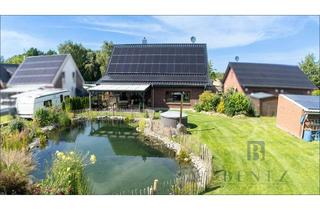 Einfamilienhaus kaufen in 27639 Nordholz, Neuwertiges Einfamilienhaus mit Schwimmteich - modernes Wohnen trifft Naturidylle
