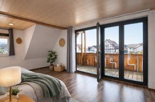 Wohnung kaufen in 63584 Gründau, Fast wie ein eigenes Haus – charmante Maisonette-Wohnung mit Kamin, Balkon & Dachstudio