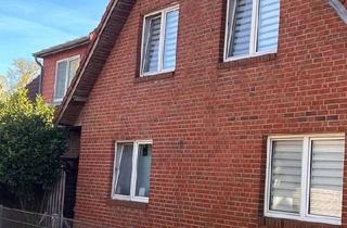 Wohnung kaufen in 26871 Papenburg, Papenburg - Haushälfte in einem Dreifamilienhaus