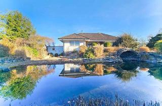 Haus kaufen in 53560 Vettelschoß, Vettelschoß - Rarität! Winkelbungalow mit traumhaftem Schwimmteich und Doppelgarage. Nur 5 Min. A3 Bad Honnef