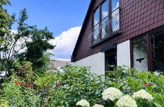 Einfamilienhaus kaufen in 30823 Garbsen, Einfamilienhaus mit Einliegerwohnung in gehobener Ausstattung mit Garage und Carport in Garbsen-Mi