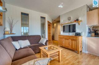Wohnung kaufen in 23774 Heiligenhafen, Ostsee-Glück! Helle Ferienwohnung mit Blick ins Grüne und Vermietungsoption