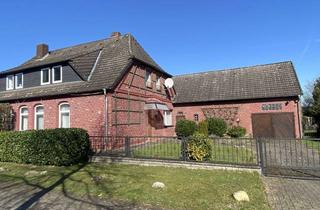 Wohnung kaufen in 29690 Schwarmstedt, BESONDERS! Eigentumswohnung im historischen Bauernhaus + Anbau m. Garage, ca. 800m² Grundstücksteil