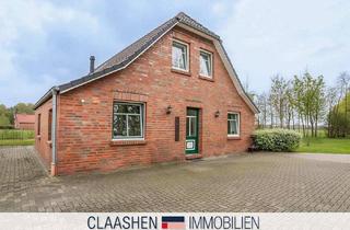 Einfamilienhaus kaufen in 26529 Upgant-Schott, Einfamilienhaus mit Weitblick, Kamin und großem Garten