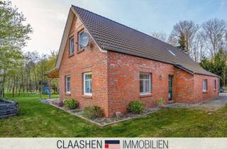 Einfamilienhaus kaufen in 26529 Upgant-Schott, Einfamilienhaus mit Weitblick, Kamin und großem Garten