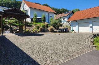Haus kaufen in 36100 Petersberg, Charmantes Anwesen mit Terrasse und Doppelgarage in ruhiger Lage von Steinau