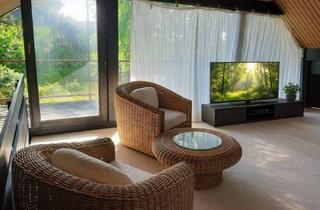 Haus kaufen in 51519 Odenthal, HUF-Haus: Elegante Architektur, inspirierendes Studio und ein Kamin für gemütliche Stunden.