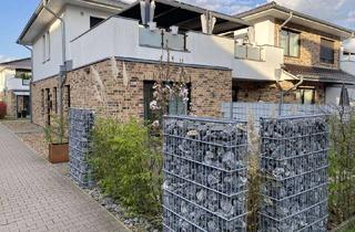 Wohnung kaufen in 28816 Stuhr, Moderne 2-Zimmer-EG-Wohnung mit Terrasse, Gartenanteil & Garage
