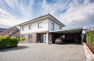 Einfamilienhaus kaufen in Sonnenbrink 12, 49163 Bohmte, Bohmte - Exklusives Einfamilienhaus mit Einliegerwohnung in familienfreundlicher Lage von Bohmte!