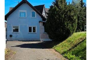 Einfamilienhaus kaufen in 54539 Ürzig, Ürzig - Einfamilienhaus mit Einliegerwohnung, Garage und Garten in Ürzig