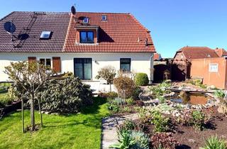 Doppelhaushälfte kaufen in 23942 Dassow, Gepflegte Doppelhaushälfte mit blühenden Garten und zwei Garagen