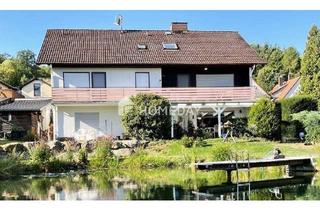 Haus kaufen in 63697 Hirzenhain, charmantes Zweifamilienhaus mit großem Garten und Schwimmteich in ruhiger Lage