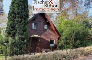 Haus kaufen in 31595 Steyerberg, Steyerberg- charmantes Holzhaus mit massivem Vollkeller in naturnaher, ruhiger Hanglage