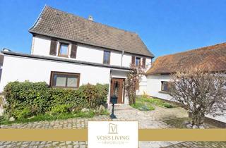 Einfamilienhaus kaufen in 61206 Wöllstadt, Wöllstadt - Charmantes Einfamilienhaus mit Nebengebäude Garten, Garage und schönem Innenhof in ruhiger Lage