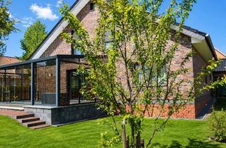 Einfamilienhaus kaufen in 32051 Herford, Modernes Einfamilienhaus mit Wintergarten und Garage auf großem Grundstück in Herford