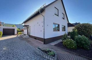 Einfamilienhaus kaufen in 65479 Raunheim, Charmantes Einfamilienhaus mit idyllischem Garten und vielseitigen Nutzungsmöglichkeiten in Raunheim