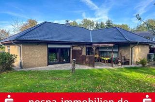 Haus kaufen in 25853 Drelsdorf, Gepflegter Winkelbungalow mit Südwest-Terrasse und massiver Garage in Drelsdorf