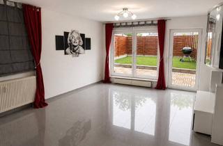 Wohnung kaufen in 73614 Schorndorf, 4-Zimmer Erdgeschoss-Wohnung mit eigenem Garten, Einbauküche und 2 Tiefgaragen-Stellplätzen