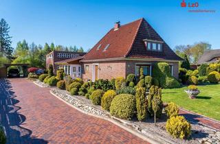 Haus kaufen in 26689 Apen, Modernisierter Bungalow mit Wintergarten und großem Garten in Augustfehn II