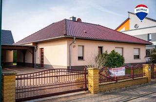 Haus kaufen in 39218 Schönebeck, Wohnglück auf einer Ebene – Winkelbungalow mit Südterrasse und Kamin