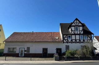 Einfamilienhaus kaufen in 34266 Niestetal, Niestetal - Gemütliches Einfamilienhaus mit separater Gewerbefläche und sonnigem Garten