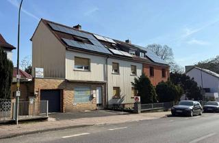 Mehrfamilienhaus kaufen in 60437 Nieder-Eschbach, Mehrfamilienhaus mit Ladeneinheit und Entwicklungspotenzial auf großzügigem Grundstück in Frankfu...