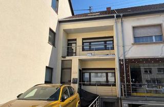 Haus kaufen in 66773 Schwalbach, Reihenmittelhaus mit Garten und Stellplatz in zentraler Lage von Hülzweiler