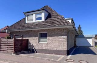 Einfamilienhaus kaufen in 26180 Rastede, Charmantes Einfamilienhaus mit Garage, Einliegerwohnung und schönem Garten direkt in Rastede!